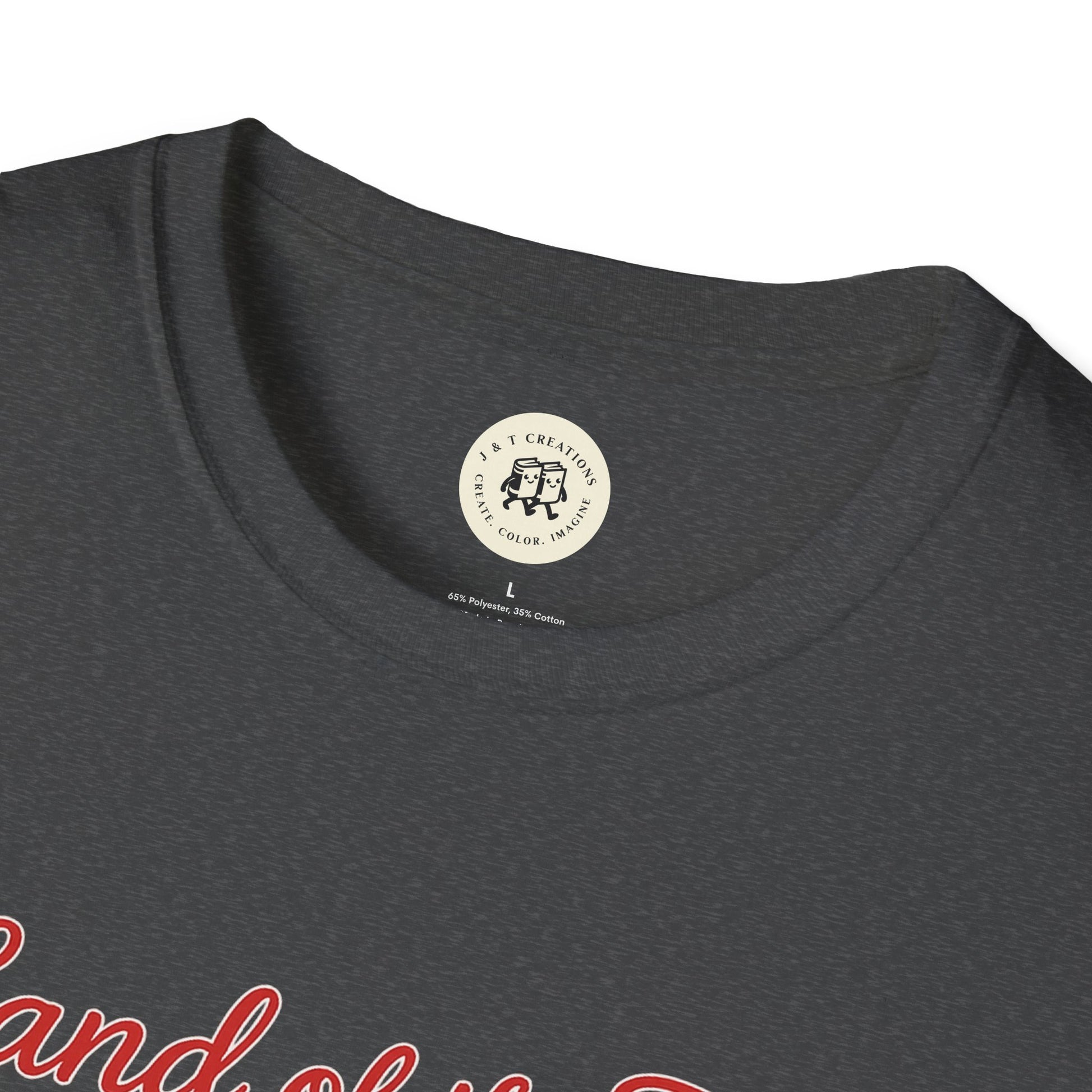 Close-up of Printify Land of the Free shirt neckline and tag on dark gray T-shirt