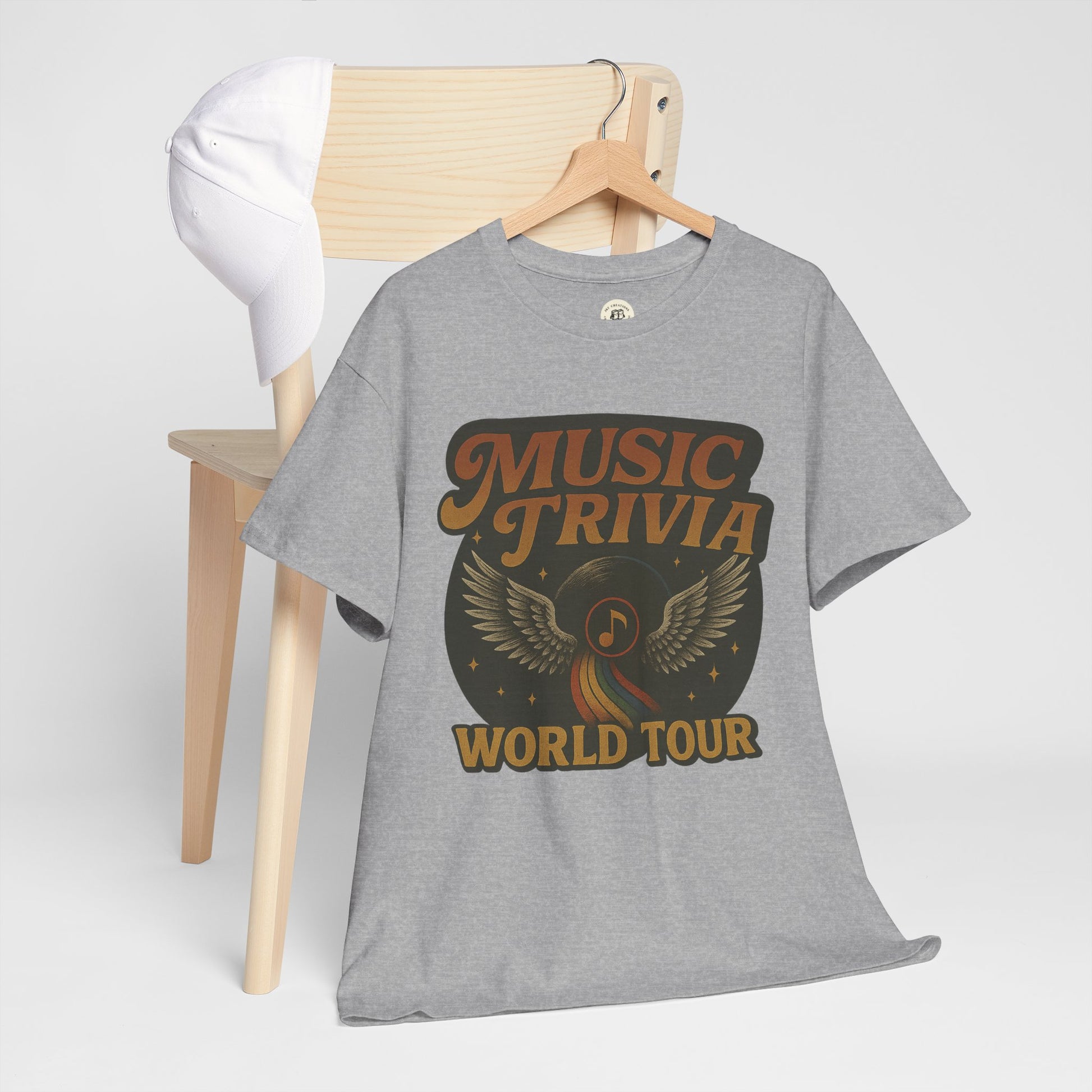Gray music trivia t-shirt with vintage style music note and wings design hanging on wooden chair