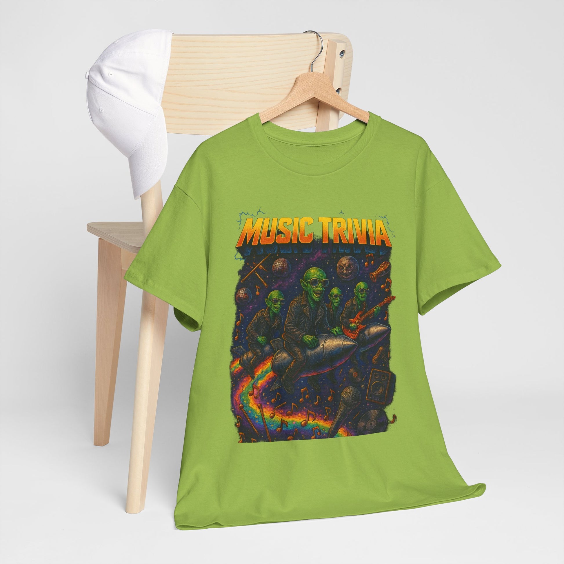 Green music trivia t-shirt with colorful graphic of zombie band riding a rocket displayed on wooden hanger