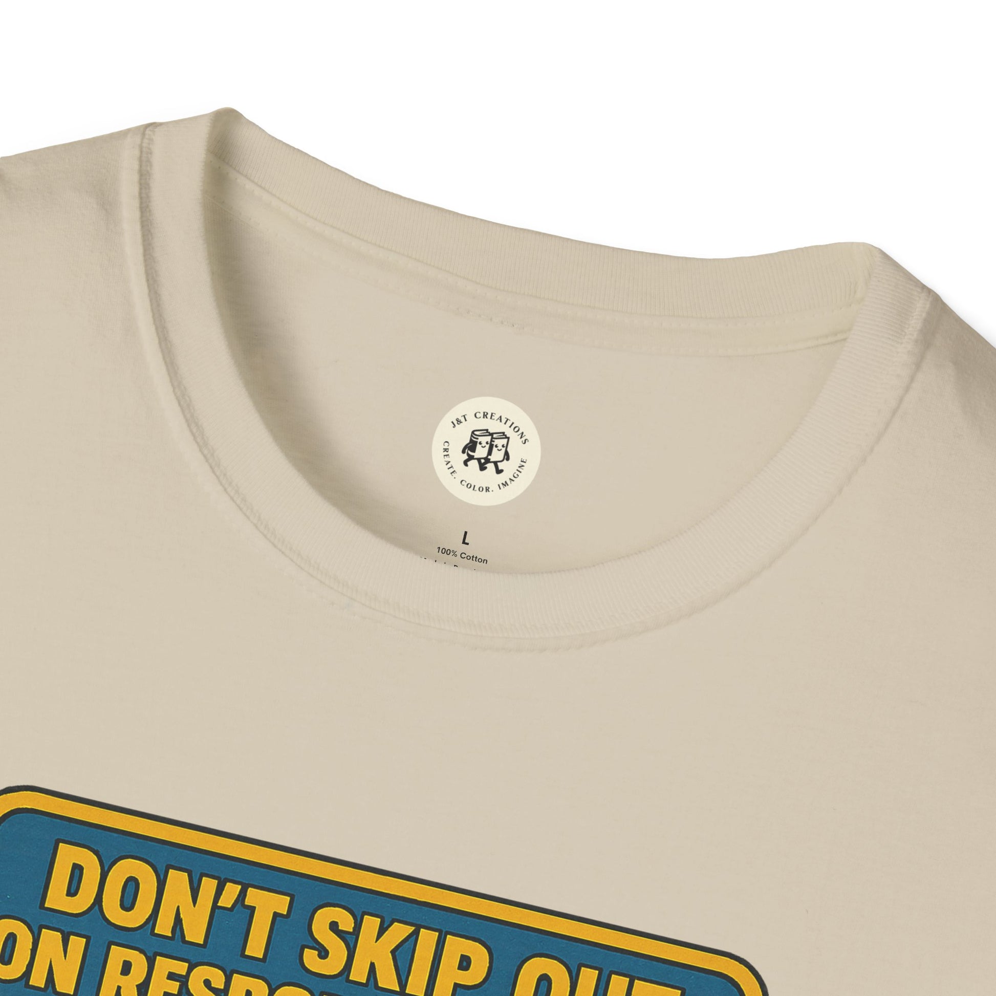 Close-up of Printify Tom Sawyer vintage t-shirt cream color with bold yellow and blue text design