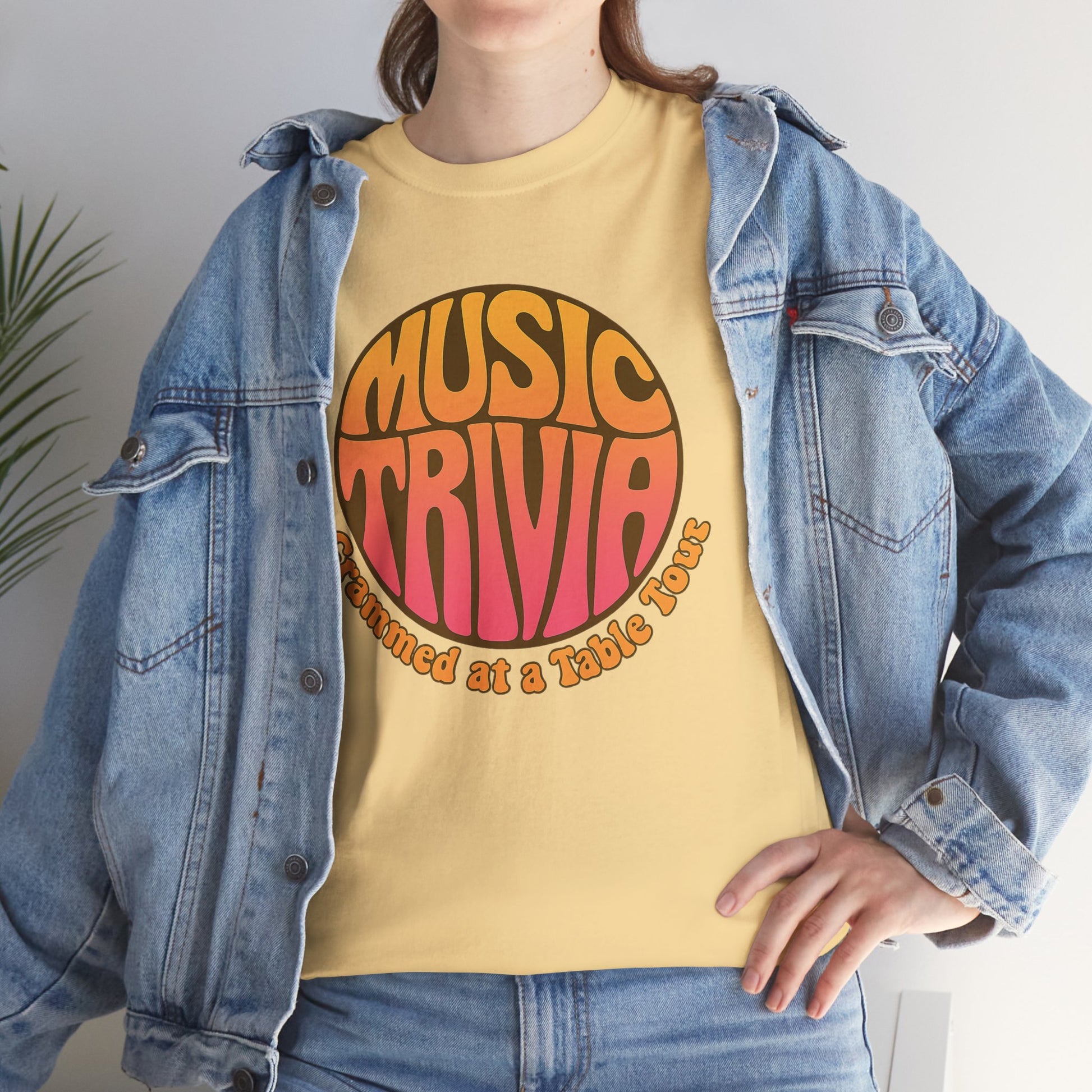 Vintage music trivia t-shirt with colorful retro design worn under denim jacket